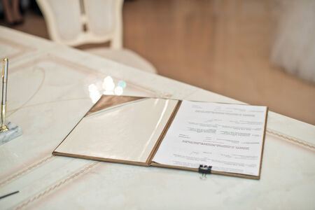 The document on a marriage on a table before signing.の写真素材