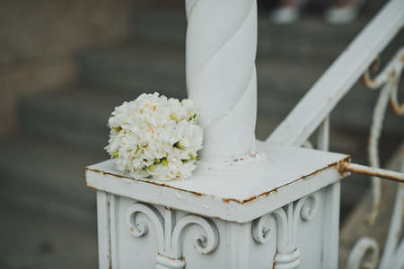 Bouquet from beige roses on a shod handrail.の写真素材
