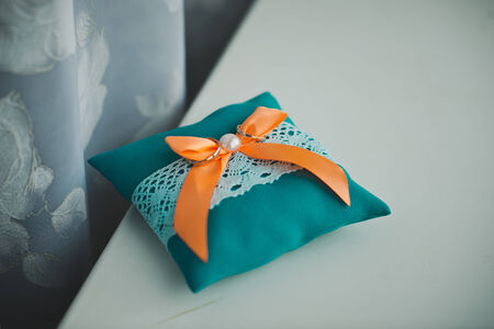 Wedding rings on a pillow before wedding.の写真素材