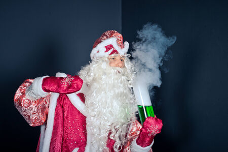 Flasks and test tubes with characters of New Years and Christmas fairy tales.の写真素材