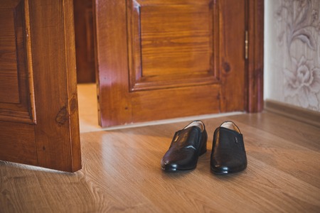 Boots about doors in a room.の写真素材