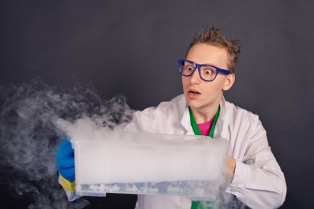 Creative scientists make experiments with liquid ice.の写真素材