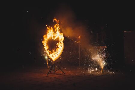 Heart from fire and fireworks.の写真素材