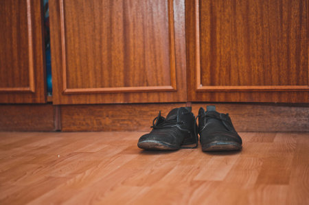 Boots stand on the floor about a case.の写真素材