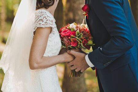 The groom gently embraces the bride.の写真素材