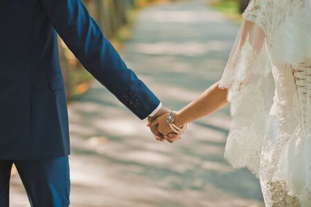 The groom gently embraces the bride.の写真素材
