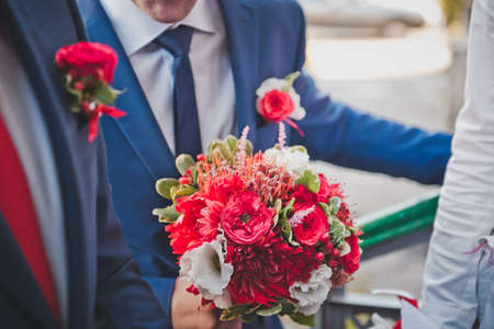 The man with flowers in hands.の写真素材