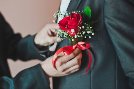 Process of clothing of decorative details of mans clothes.の写真素材