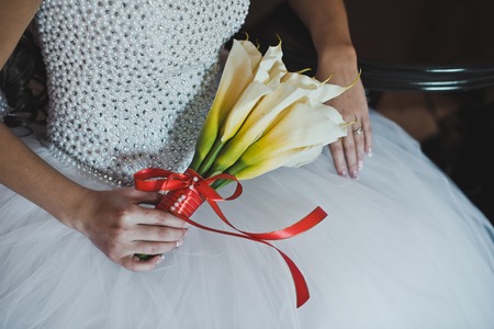 The girl holds a bouquet.の写真素材
