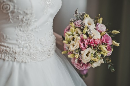 Bouquet of beautiful flowers in hands of the girl.の写真素材