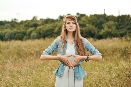 The girl gesticulates hands.の写真素材