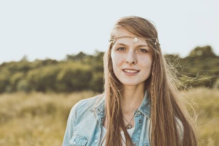 Summer portrait of the girl in the field.の写真素材
