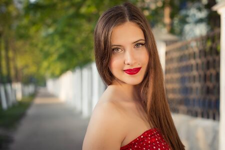 The girl with brightly red lipstick.の写真素材