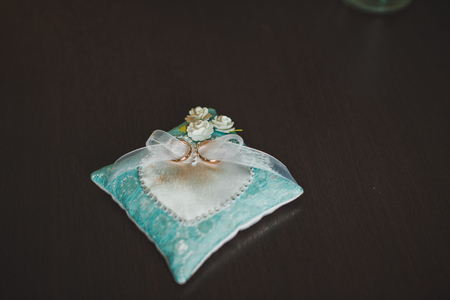 Wedding rings on a pillow.の写真素材