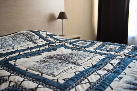 Big warm blanket on a bed.