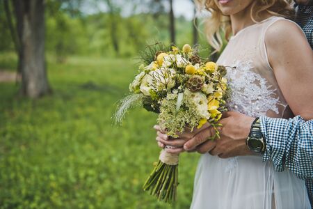 Bunch of flowers in hands of the girl.の写真素材