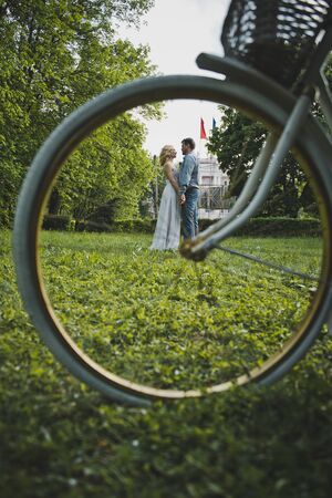 Walk of the girl and the guy with a bicycle.の写真素材