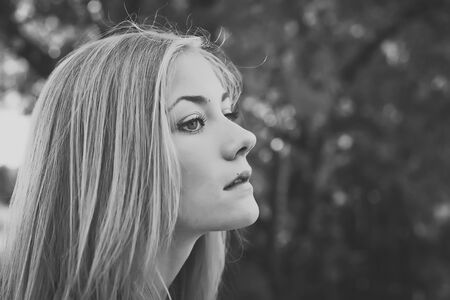 The girl against trees.の写真素材