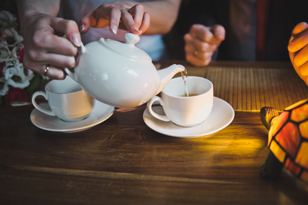Filling teacups tea.の写真素材