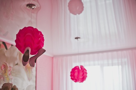 Shoes hung on a sphere.の写真素材