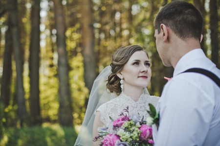 The bride looks into the eyes of the groom.