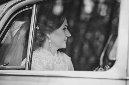Portrait of a girl through the car window.の写真素材