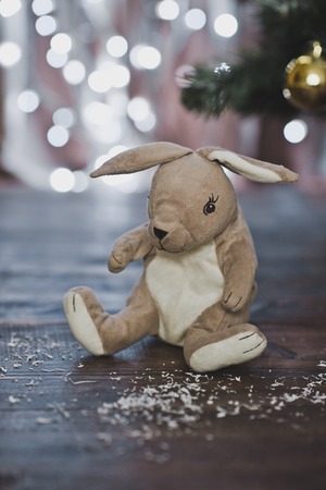 Toy hare under the tree.の写真素材