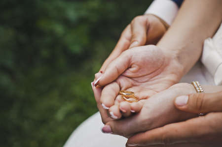 The arms of the palms with rings.の写真素材