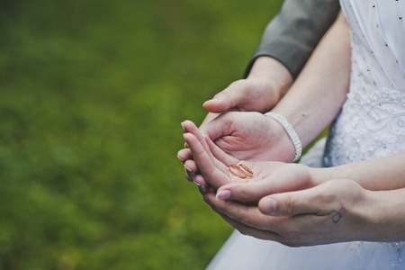 The arms of the palms with rings.の写真素材