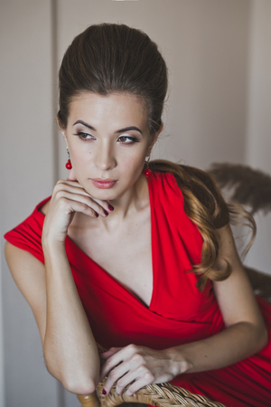 A woman in a long red dress.の写真素材