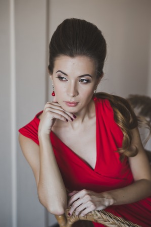 A woman in a long red dress.の写真素材