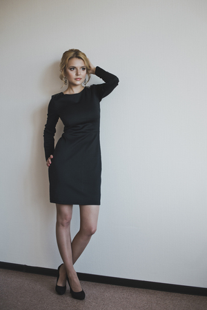 A girl in a little black dress.の写真素材