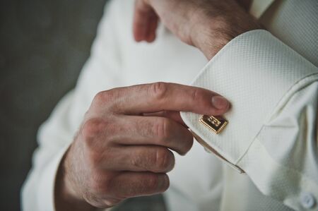 The process of dressing businessman.の写真素材