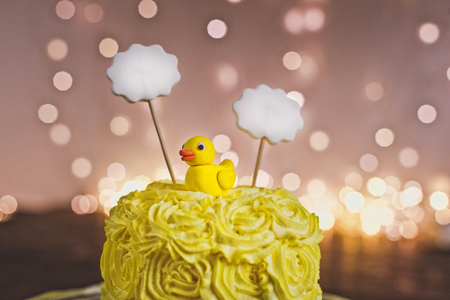 A little yellow cake on the stand.の写真素材