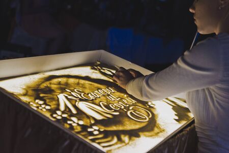 Sand painting on a light table.の写真素材