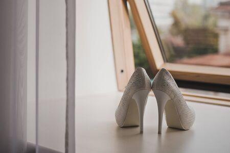 White shoes on the windowsill.の写真素材
