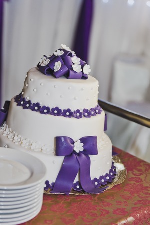 Great wedding cake with purple decorations.の写真素材