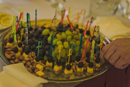 Snacks from son on a skewer on a tray.の写真素材