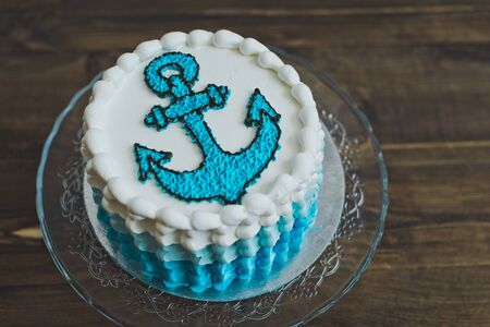 A cake with an anchor for the child.の写真素材