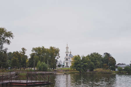 Landscape with an old bridge at the river.の写真素材