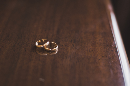 Two rings on a wooden table.の写真素材