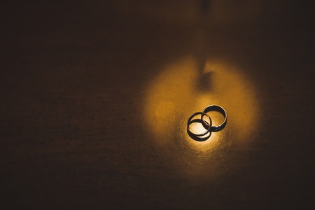 Two rings on a wooden table.の写真素材