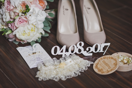 Shoes and jewelry bridesmaid on the brides table.の写真素材