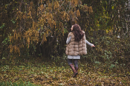 The girl happily strolling through the Park in anticipation of the child.の写真素材