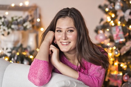 Girl with a beautiful face a Christmas decorations.の写真素材