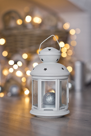 Lantern for candle in the background of the Boke from the lights of garland.の写真素材
