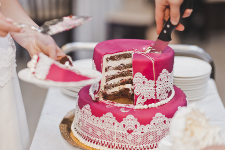 The division into parts of the wedding cake.の写真素材