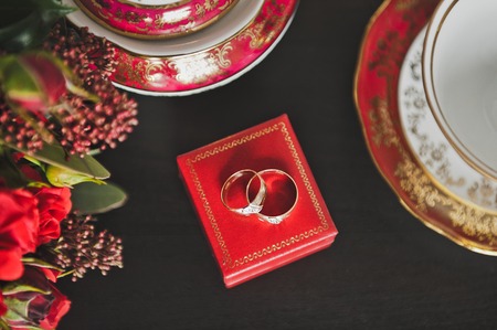 Artsy wedding rings on the red box.の写真素材