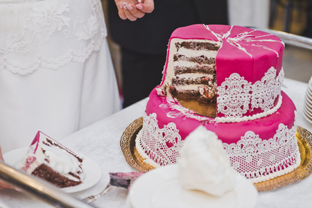 Pink with white decorations cake.の写真素材