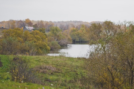 The banks of the river dressed in autumn forest.の写真素材